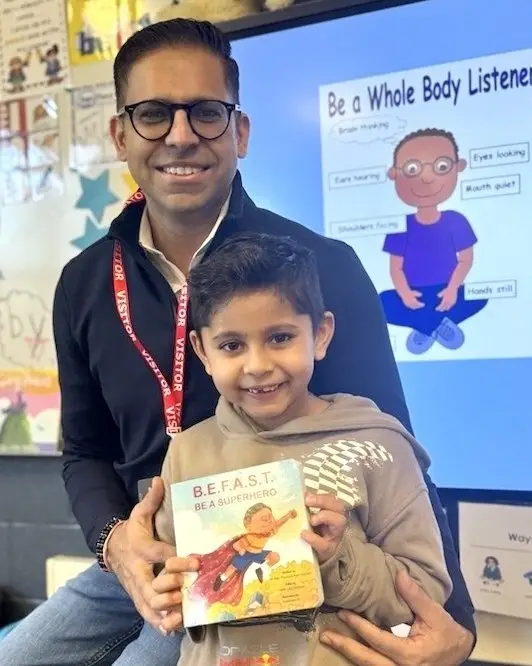 Sevaro CEO Dr. Raj Narula, Father and his son pose with the BEFAST Be A Superhero book